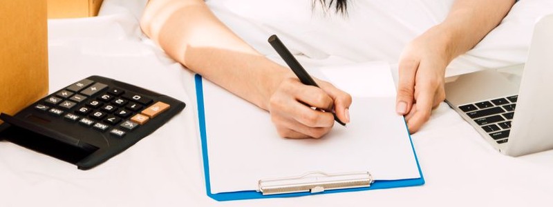 cropped picture of a person creating a budget