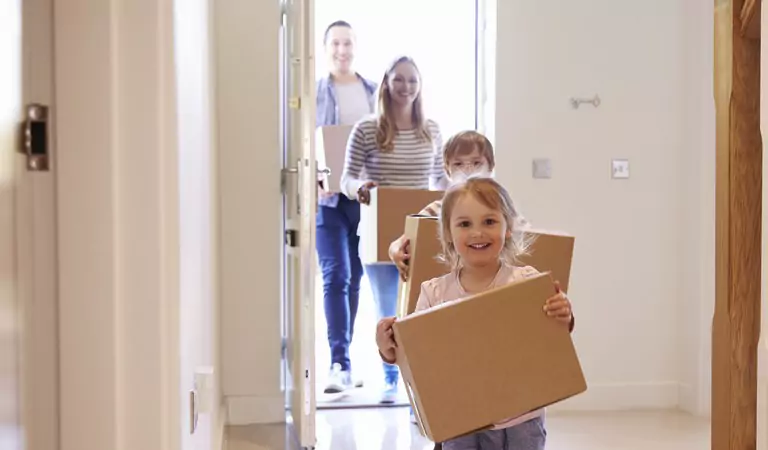 family arriving at their new house