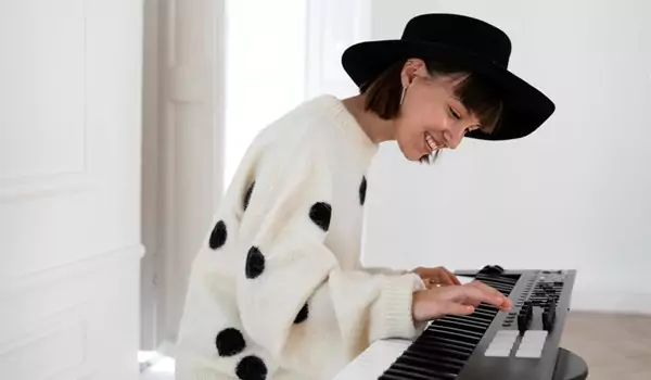 woman checking a piano