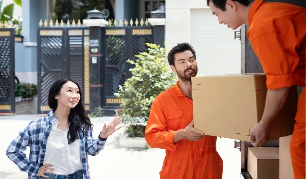men unloading boxes for customer